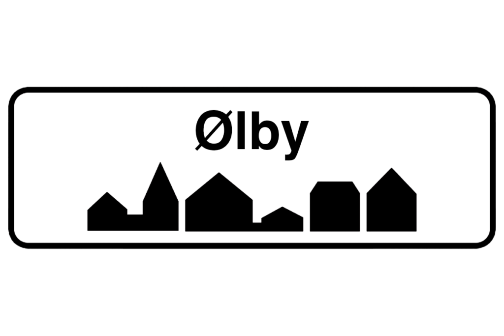 Byskilt med teksten "Ølby" i fokus, der fremhæver bynavnet og understøtter vores malerfirma i Ølby.