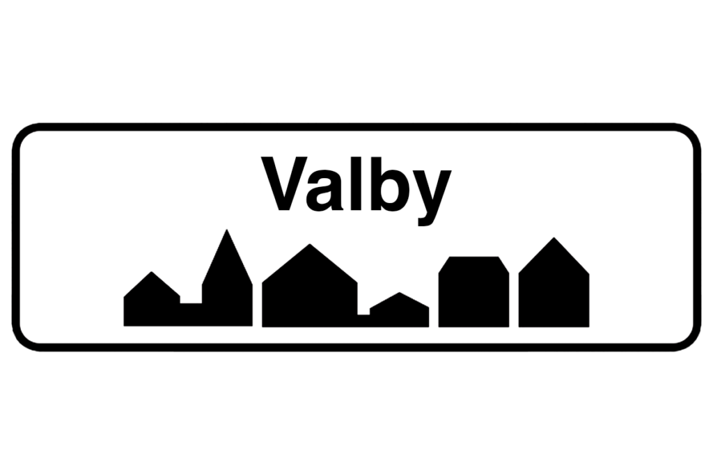 Byskilt med teksten "Valby" i fokus, der fremhæver bynavnet og understøtter vores lokale malerfirma i Valby.