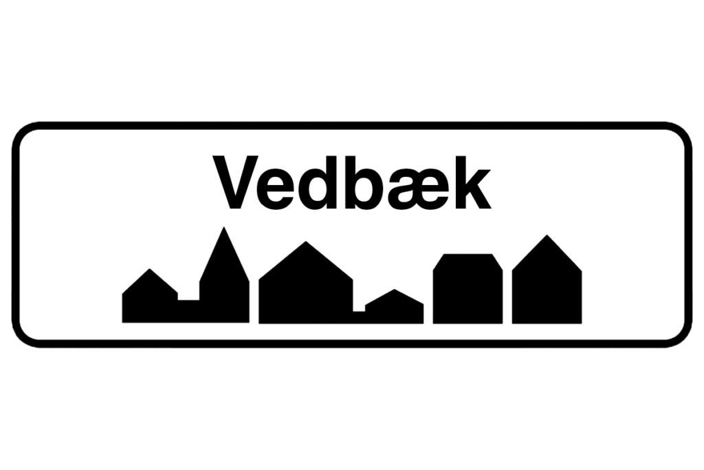 Byskilt med teksten "Vedbæk" i fokus, der fremhæver bynavnet og understøtter vores malerfirma i Vedbæk.